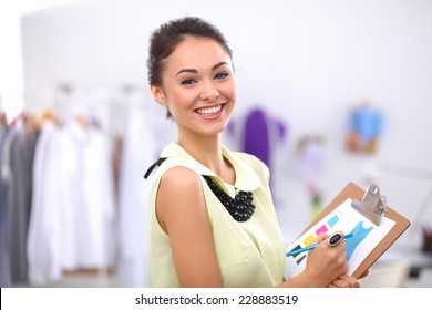 Modern Young Fashion Designer Working At Studio.isolated