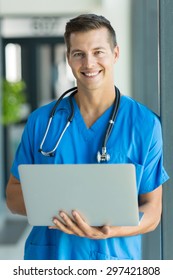 modern young male nurse using laptop