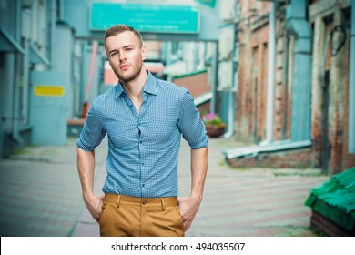 Modern Young Man Standing On A City Street On A Summer Day. Men's Fashion. 