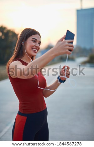 Similar – Attractive sporty woman with her cell phone