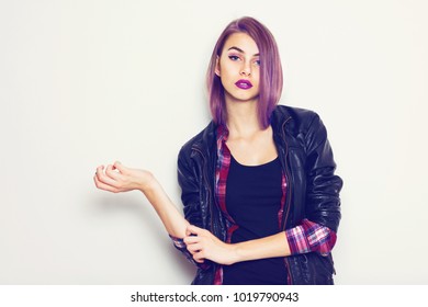 Modern Young Woman With Purple Hair And Lipstick Posing