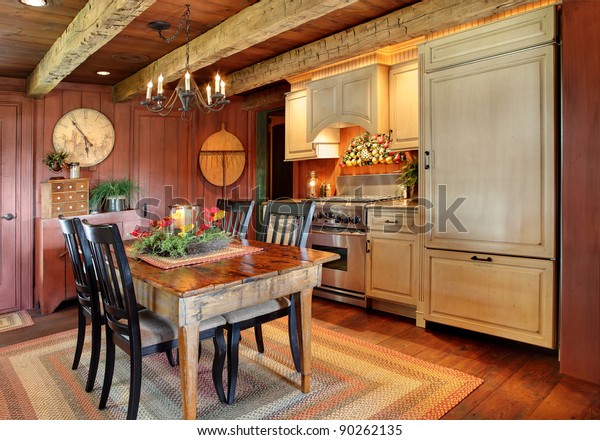 A
modernized kitchen in a primitive colonial style reproduction home.
 The styling is authentic primitive colonial, with modern amenities
added to make the home functional and
comfortable.