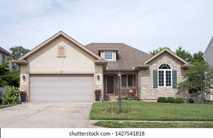 Modest Midwestern House With Tan Stone & Stucco