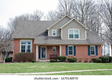 Modest Red Brick House With Black Shutters