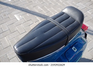 Modified motorcycle seat for this type of scooter that still maintains its classic style. - Powered by Shutterstock