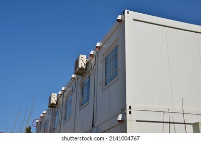 Modular Housing In Stacked Container Cells. Each Module Has A Different Function. Part Is A Stair Toilet, Office Kitchen And Air Conditioning On The Wall. Connected Power Cables In The Socket