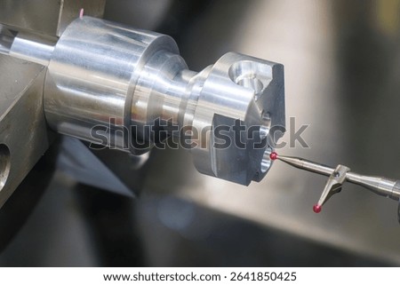 The modular touch probe checking the aluminum shaft parts on CNC lathe machine. The quality control of turning parts with CMM probe.