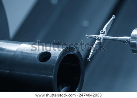 The modular touch probe checking the tube parts on CNC lathe machine. The quality control of turning parts with CMM probe.