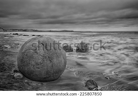 Moeraki Boulders on the Koekohe beach, Eastern coast of New Zealand. HDR image, black and white
