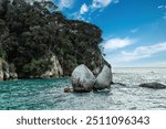 The Moeraki Boulders are unusually large spherical boulders lying along a stretch of Koekohe Beach on the wave-cut Otago coast of New Zealand between Moeraki and Hampden.