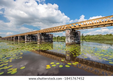 The Moerputtenbrug is a former Dutch railway bridge. The bridge was used as a railway bridge from 1887 to 1972. Currently, the restored bridge is a footpath above a wetland nature reserve.