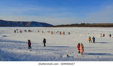 Mohe, China - Feb 19, 2017. People Walking On Ice River At Winter In Mohe County, Heilongjiang Province, China.