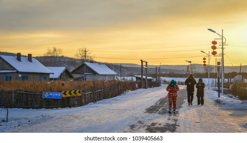 Mohe, China - Feb 19, 2017. People Walking At Snow Village In Mohe County, Heilongjiang Province, China.