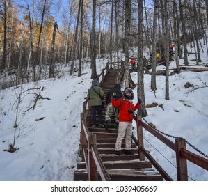 Mohe, China - Feb 19, 2017. People Hiking On Wooden Trail At Winter In Mohe County, Heilongjiang Province, China.