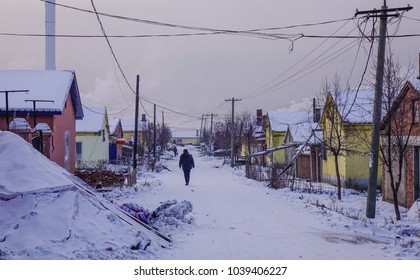 Mohe, China - Feb 19, 2017. People Walking On Rural Road At Winter In Mohe County, Heilongjiang Province, China.