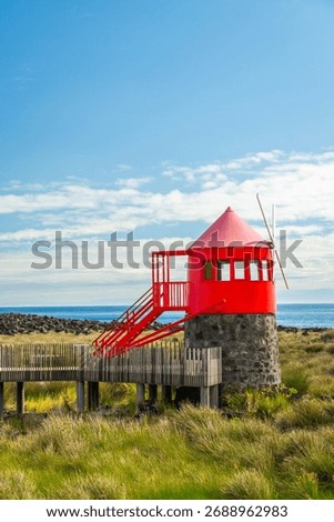 Moinho do Juncal Windmill and Atlantic Ocean. Lajes, Pico Island, Azores. Portugal