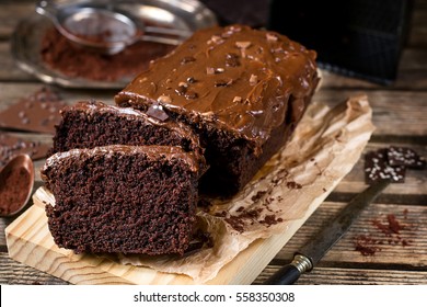 Moist Chocolate Cake With Milk Chocolate Topping Glaze And Cocoa Powder