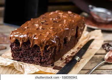 Moist Chocolate Cake With Milk Chocolate Topping Glaze And Cocoa Powder