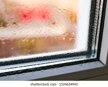 Moist Word Written On Wet Window. High Level Of Dampness In Apartment. Window Glass With High Air Humidity. Background Of Natural Water Condensation