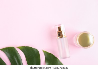 Moisturizing care skincare face cream for healing complicated troubled skin type in an open jar with visible texture. Copy space, close up, background, flat lay, top view. Monstera leaf decoration.