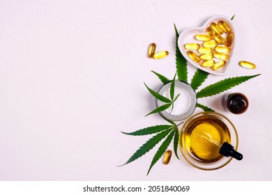 Moisturizing Cream With Marijuana Leaves, Cbd Oil With Dropper And  Capsules On White Background. Overhead Composition With Copy Space. Biological And Ecological Hemp Plant Herbal Pharmaceutical Cbd.