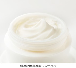 Moisturizing cream in an open jar. Close-up view.