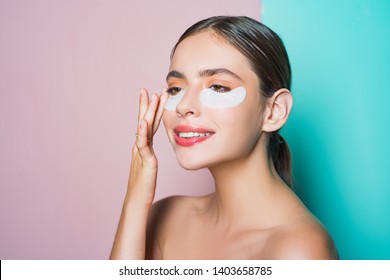 Moisturizing Eye Patches. Taking Care Of Her Skin. Woman Using Eye Patches Spending Time At Home. Daily Pampering Routine. First Care Than Put Make Up On. Modern Cosmetics. Eye Patches Concept.