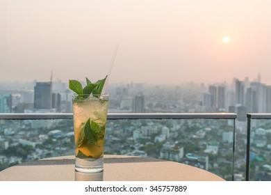 Mojito Cocktail On Table In Rooftop Bar