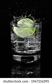 Mojito Lime Water With Splash Highball Glass Gin And Tonic On Dark Background. Food Menu Restaurant.