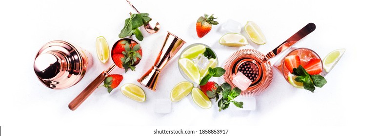 Mojito mocktail set with lime, mint, strawberry and ice on white background. Cold alcoholic non-alcoholic long drinks, beverages and cocktails