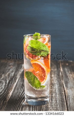 Mojito with red oranges. Selective focus. Shallow depth of field.