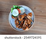 Mojokerto, East Java, 23 Nov 2024, processed chicken wings with sauce and sesame or wijen sprinkles