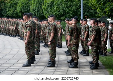 Chișinău, MOLDAVA - JUN 25, 2014: Moldovan Army Soldiers, In Camouflage Fatigues, Stand At Attention At A Ceremony In Cathedral Park.