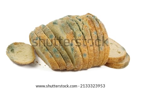 Moldy bread cut into pieces. Isolated on a white background