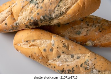 Moldy Bread On Blurry Background. Food Fungus. Dirty Food That Is Unappetizing.