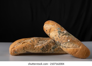 Moldy Bread On Blurry Background. Food Fungus. Dirty Food That Is Unappetizing.