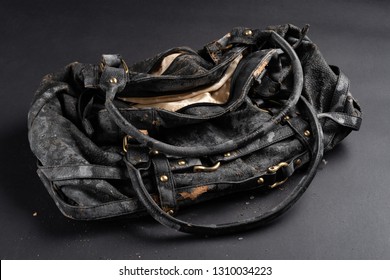 Moldy Leather Bag On Dark Background