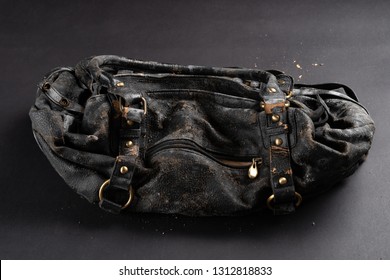 Moldy Leather Bag On Dark Background