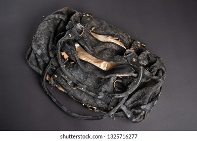 Moldy Leather Bag On Dark Background