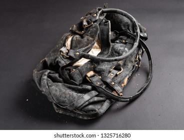 Moldy Leather Bag On Dark Background