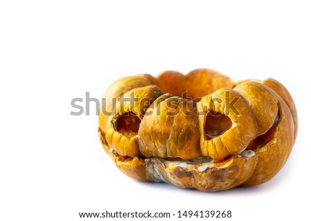Moldy scary Halloween pumpkin with rotten spots on a white background with space for text on the top and left