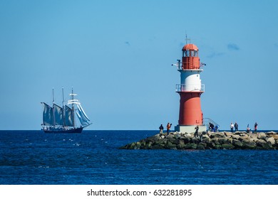 The Mole And A Tall Ship In Warnemuende, Germany.