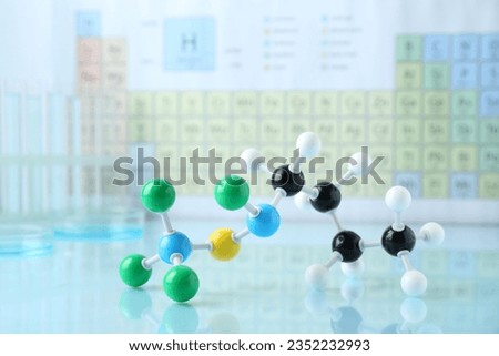 Molecular model on light surface against blurred background