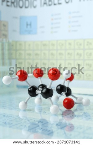 Molecular model on mirror surface, closeup view