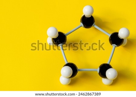 Molecular model structure of cyclopentane. A ring of carbon atoms. Chemical formula concept. Organic chemistry model that visualizes the bonds between atoms in 3D