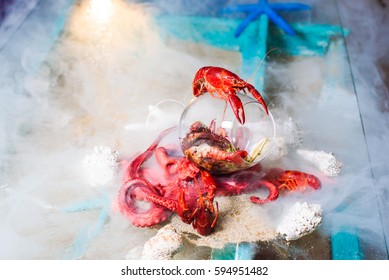 Molecular Modern Cuisine Dish Made Of Octopus And Crab Placed In Glass And Covered With Nitrogen Smoke. Food Gourmet. Molecular Cuisine