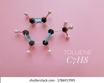 Molecular structure model and chemical formula of toluene molecule. Toluene (toluol) is an aromatic hydrocarbon, a flammable liquid with a pungent odor, it is widely employed as an organic solvent.