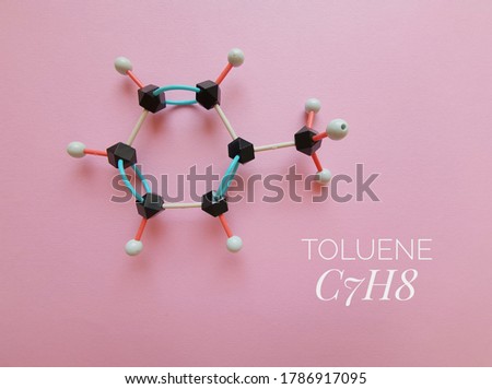 Molecular structure model and chemical formula of toluene molecule. Toluene (toluol) is an aromatic hydrocarbon, a flammable liquid with a pungent odor, it is widely employed as an organic solvent.