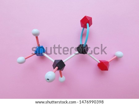 Molecular structure model of glycine molecule. Glycine ( Gly or G) is the simplest amino acid and one of the proteinogenic amino acids. Black=C, red=O, blue=N, white=H.
