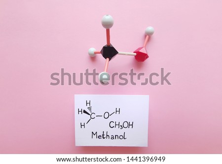 Molecular structure model and structural chemical formula of methanol molecule. CH3OH, ball-and-stick model and skeletal formula. Black=C, red=O, white=H.